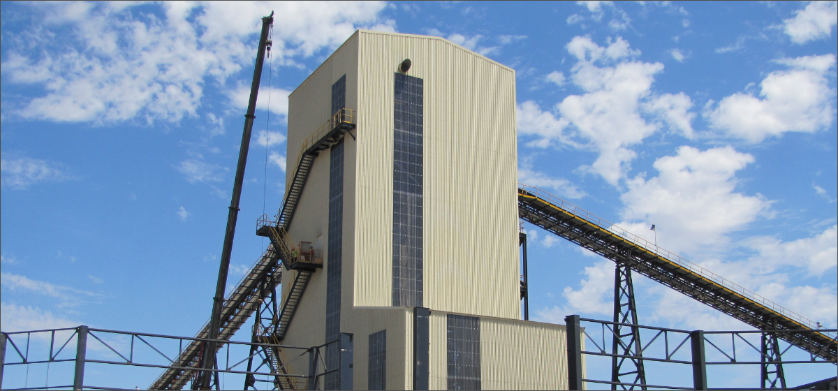 Belt conveyors and a transfer tower at a bulk material handling plant